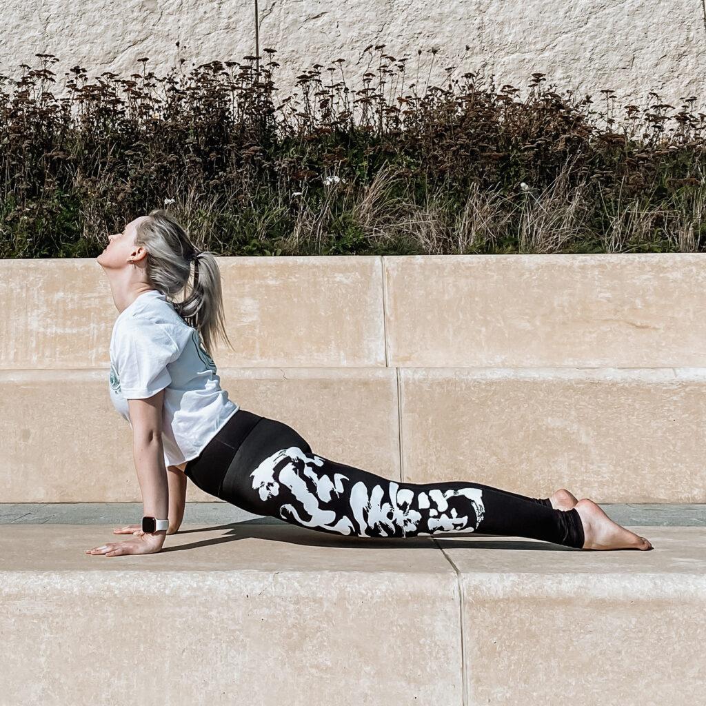 A girl doing upward facing dog