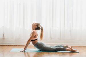 woman doing a cobra yoga pose