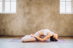 woman doing fish yoga pose